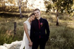 husband and wife holding hands in sunset