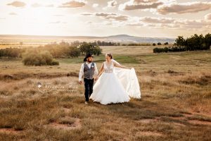 bride and groom in the sunset with a beautiful view